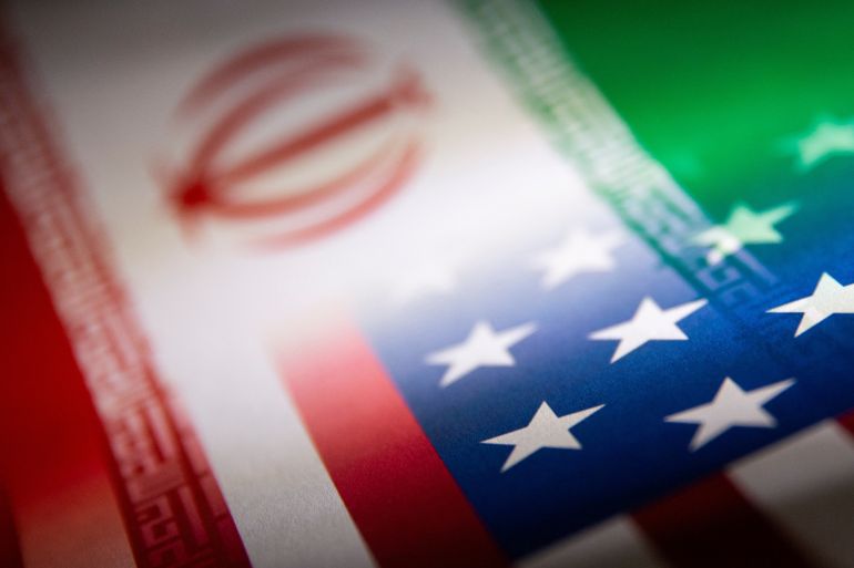 Iran and US flags printed on paper in this illustration from January 2022. [Dado Ruvic/Illustration/Reuter
