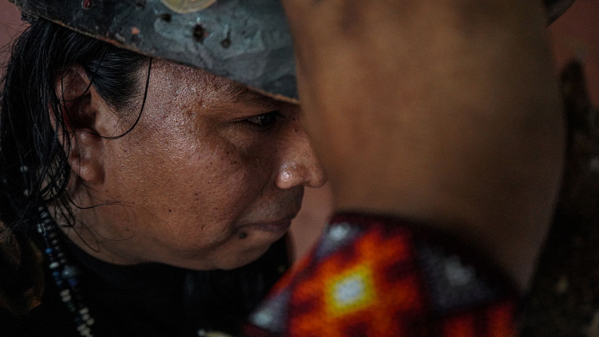 A close-up photo of Melvin Gonzalez, 42, at his home and mask-making workshop.