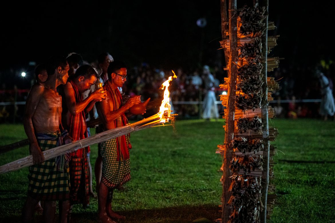 Indian Rabha tribal Hindu priests perform rituals