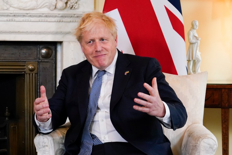UK Prime Minister Boris Johnson gestures as he meets Estonia's Prime Minister Kaja Kallas