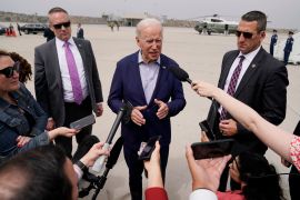 President Joe Biden speaks with reporters before boarding Air Force One at Los Angeles International Airport