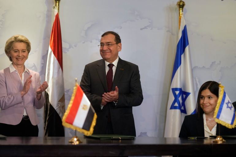 EU Commission President Ursula von der Leyen, left, Egyptian Minister of Petroleum Tarek El-Molla, center, and and Israeli Minister of Energy Israel's Energy Minister Karine Elharrar, celebrate after signing a deal to boost East Mediterranean gas exports to Europe.