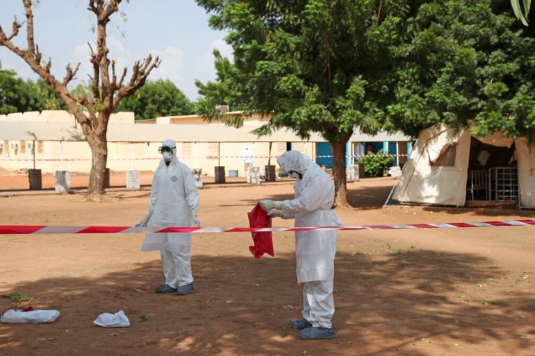 Health workers stand at a medical facility in Kayes, Mali