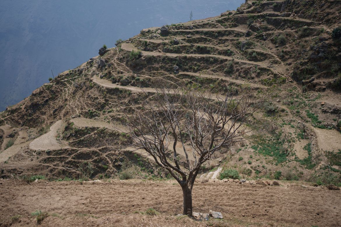 Dry empty farm land is seen in Muktikot,