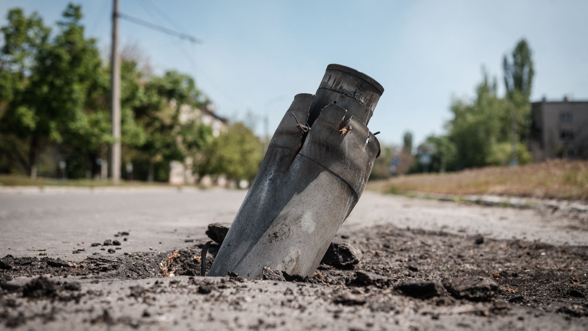 An Unexploded Ordnance is embedded on a road in Severodonetsk, eastern Ukraine.