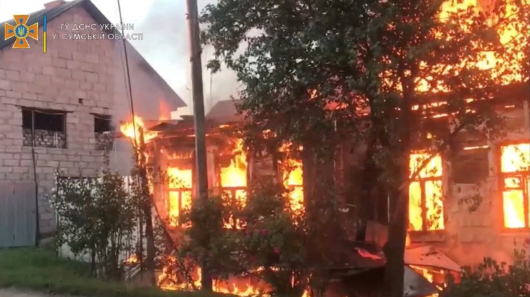 Fire burns in a building at a location given as Seredyna-Buda, Sumy region in Ukraine.