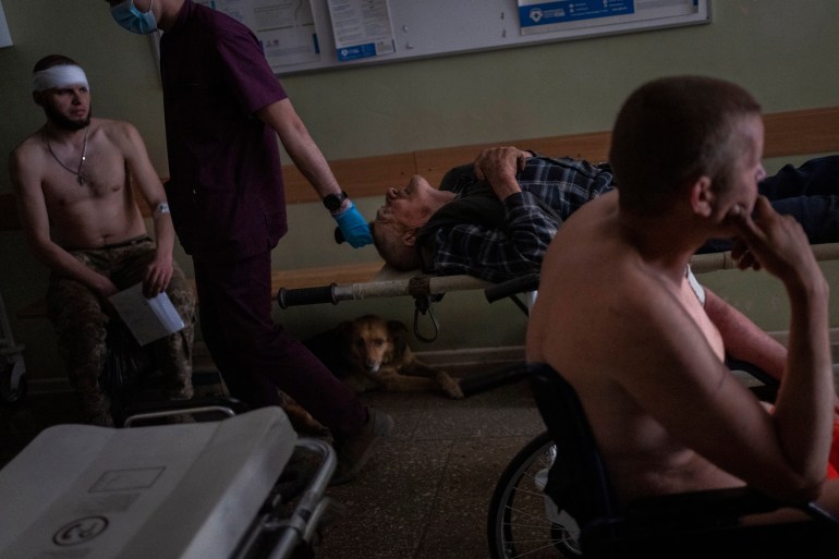 Ukrainian injured service members and an injured civilian wait for medical treatment in the Donetsk region, eastern Ukraine, Tuesday, June 7, 2022