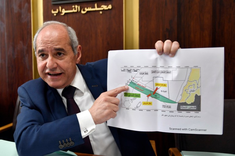 Member of Parliament Melhem Khalaf speaks during a news conference as he shows a map of Line 29 at the Lebanese Parliament building in Beirut