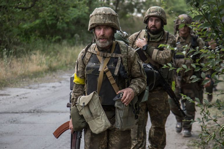 Ukrainian servicemen go to a position in the city of Severodonetsk of Luhansk area