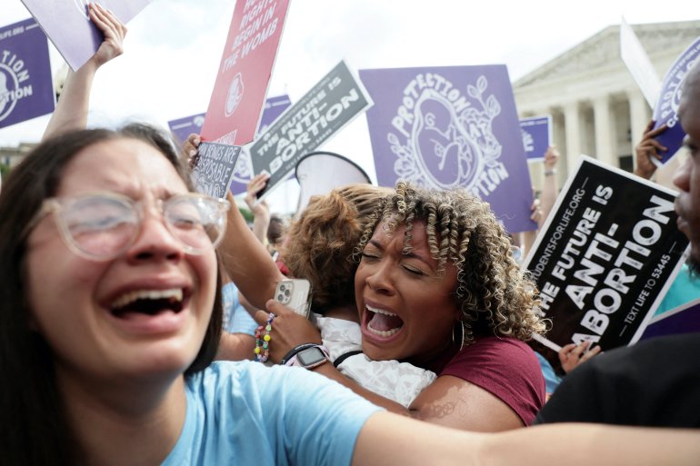 Anti-abortion demonstrators celebrate outside the United States Supreme Court as the court rules in the Dobbs v Women’s Health Organization abortion case, overturning the landmark Roe v Wade abortion decision in Washington, U.S.