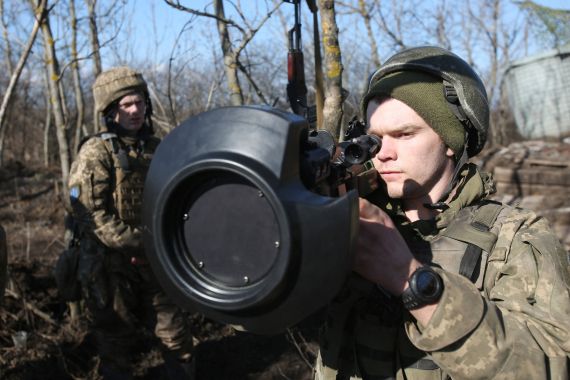 Service members of the Ukrainian Military Forces examine a Swedish-British portable anti-tank guided missile NLAW that was transferred to the units on the front line near Novognativka village, Donetsk region, Ukraine.