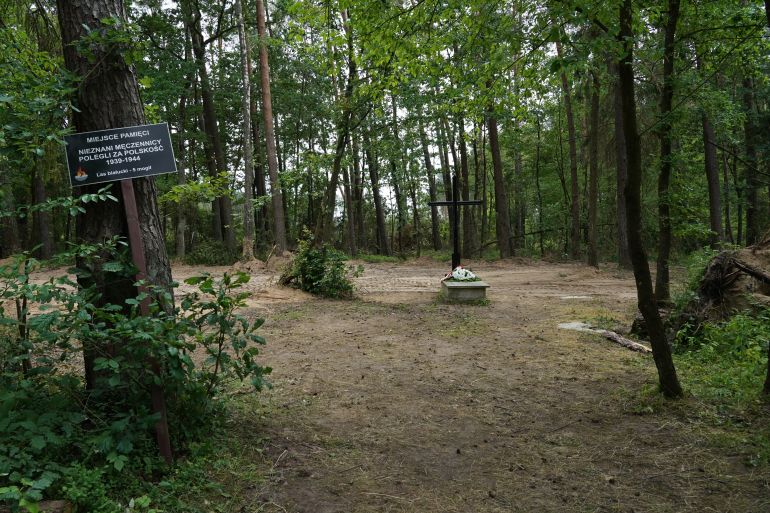 A symbolic grave in the Bialucki Forest near Ilowo, the site of a mass grave.