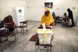 Voters cast their ballot at a polling station during the by-election in Punjab province in July 2022