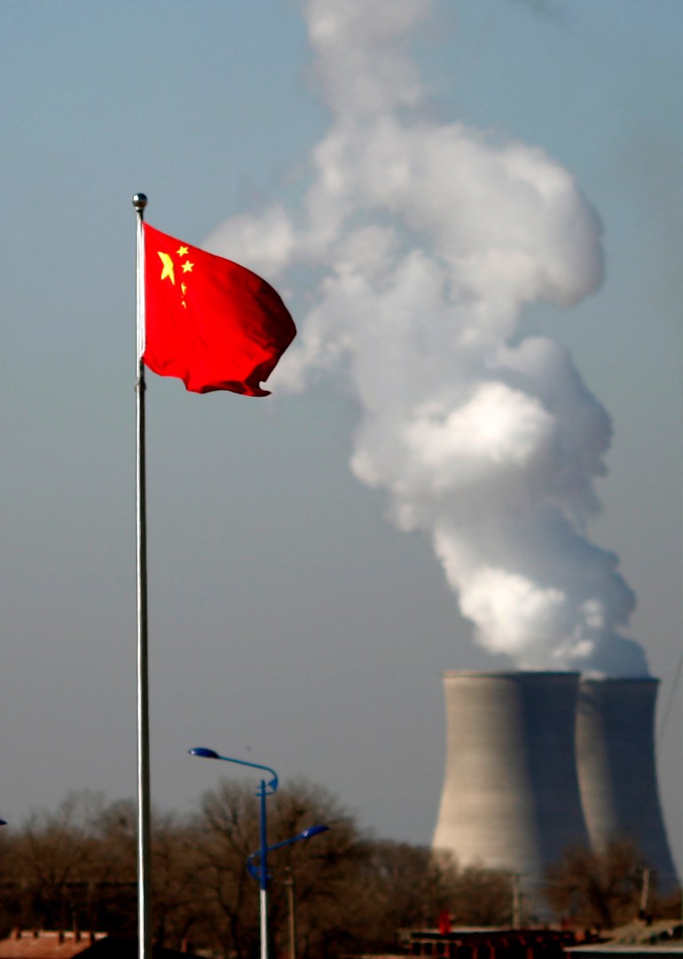 China nuclear plant with a Chinese flag flying in the foreground.