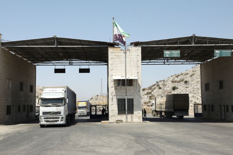Trucks drive at Bab al-Hawa crossing at the Syrian-Turkish border, in Idlib governorate, Syria, June 30, 2021. Picture taken June 30, 2021.