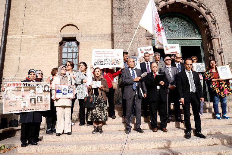Supporters of People's Mojahedin Organization of Iran protest outside Stockholm District Court on the first day of the trial of Hamid Noury.