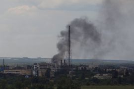 Smoke rises after a strike in Lysychansk