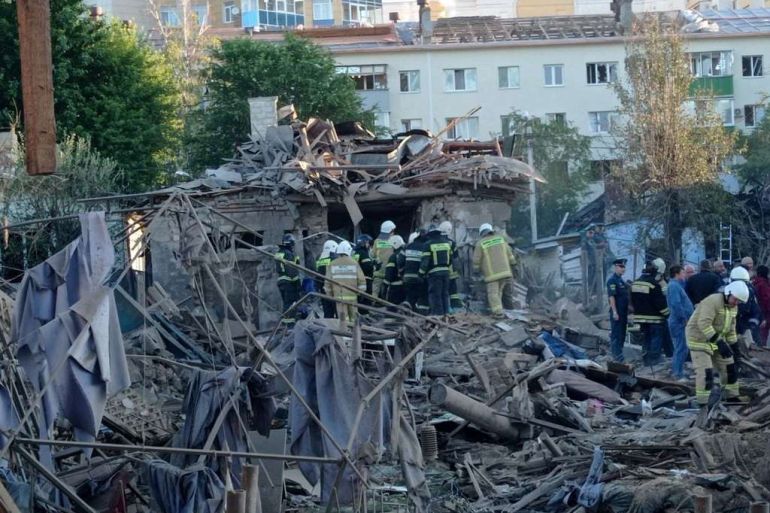 Rescue specialists work at the site of a destroyed residential building after the blasts in Belgorod, Russia July 3, 2022.