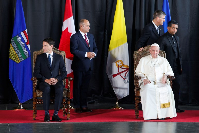 Pope Francis and Canada's Prime Minister Justin Trudeau attend a welcome ceremony at Edmonton International Airport, near Edmonton, Alberta, Canada July 24, 2022.