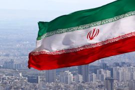 Iran flag flying over Tehran.