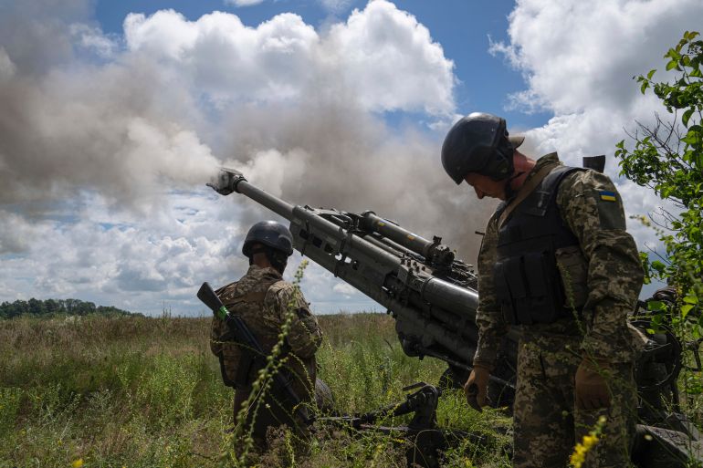 Ukrainian servicemen fire at Russian positions from a U.S.- supplied M777 howitzer in Kharkiv region,