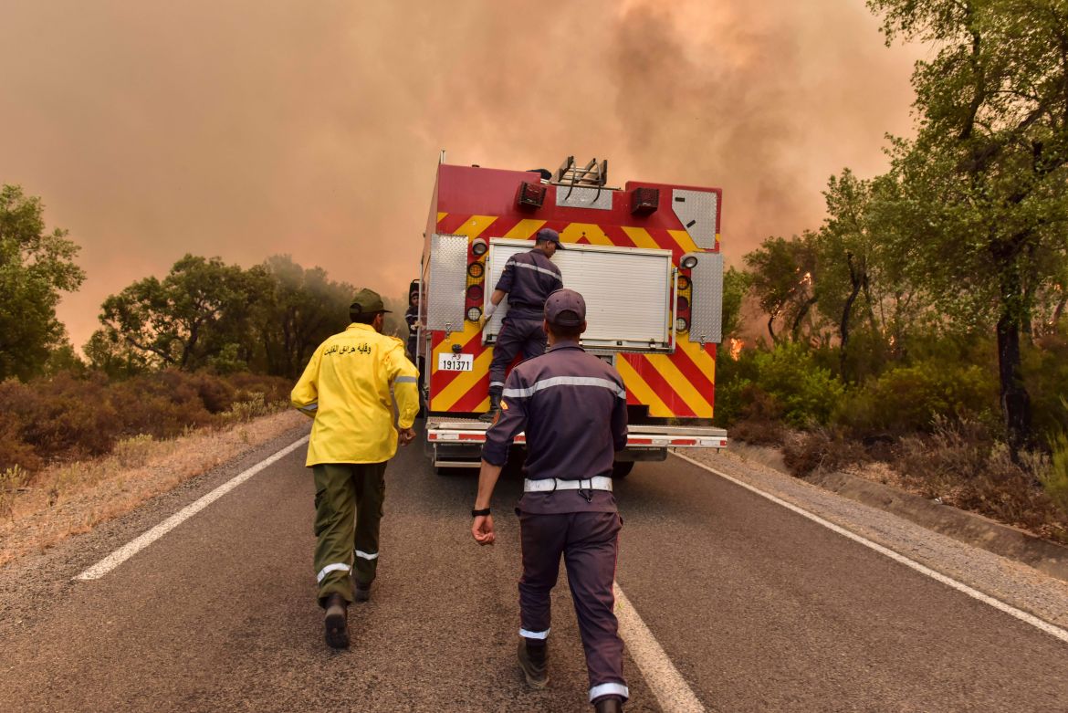 Firefighters attempt to put ot wildfires caused by extreme temperatures in Larache