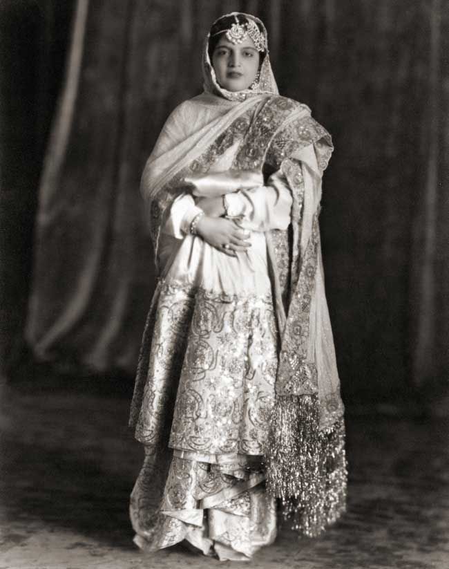 Black and white photo of Raffat Zamani Begum in her full formal wear and jewelry