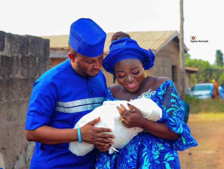 Nigerian plant scientist Rukayat Muhammed and her family carrying their child