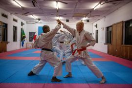 Students practice their form during training at a karate class catering to people with albinism in Nairobi, Kenya