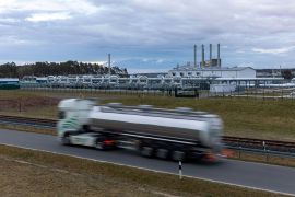 A tanker passes the gas receiving station of the halted Nord Stream 2 project on the site of a former nuclear power plant in Lubmin, Germany