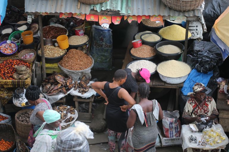 Women shop for foodstuff at the Mile 12 International food market in Lagos, Nigeria