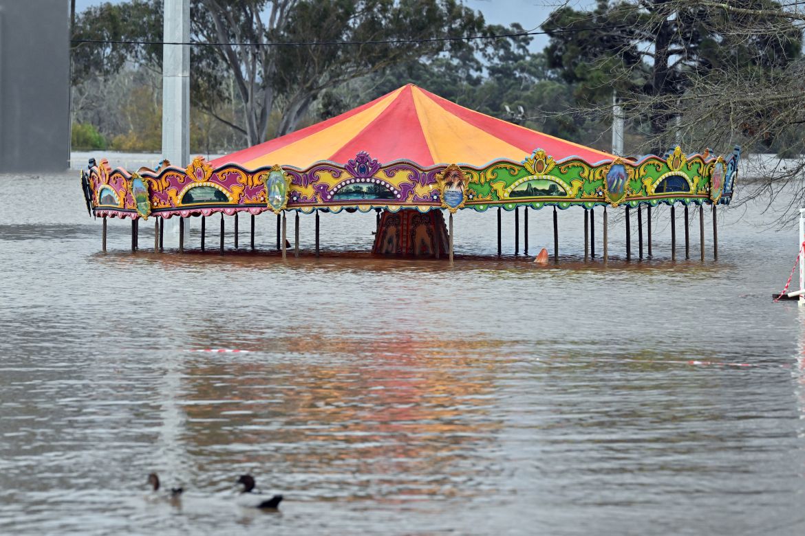 An amusement ride is seen inundated by floodwaters in Camden