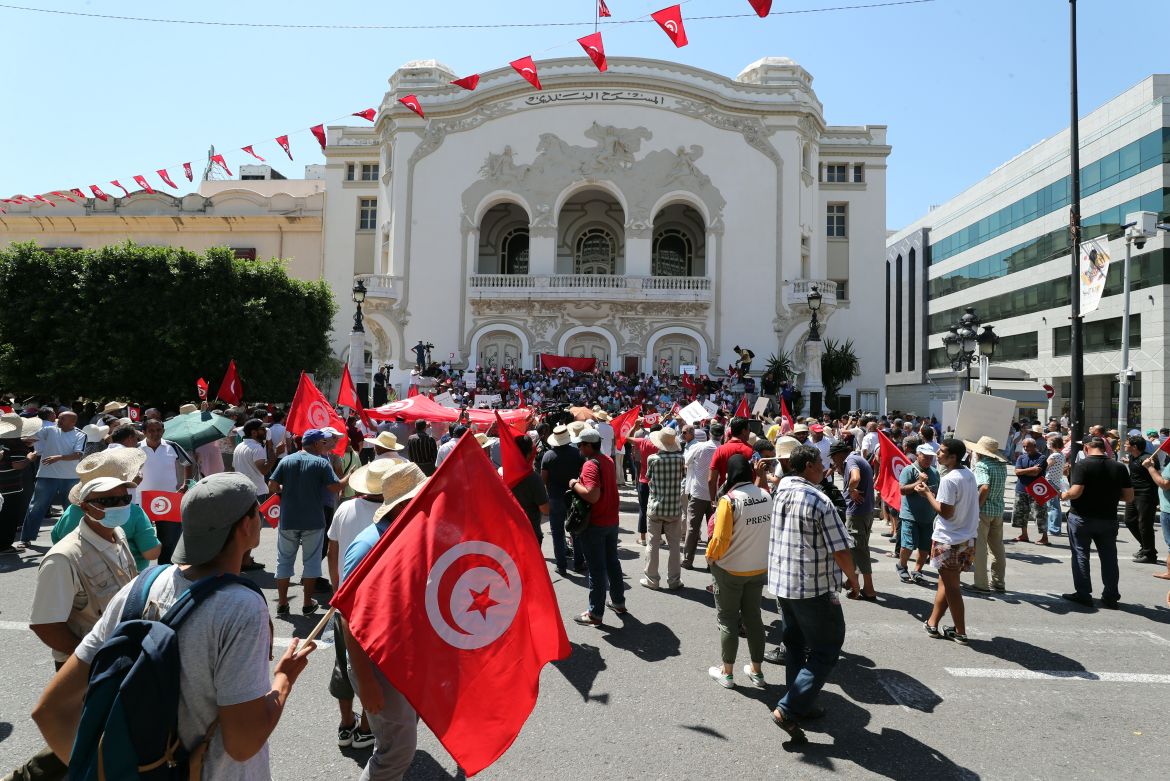 Tunisians attend a protest