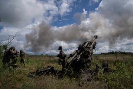 Ukrainian servicemen fire at Russian positions from a US-supplied M777 howitzer in Kharkiv region, Ukraine, July 14, 2022