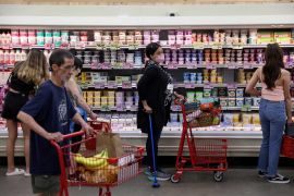 People shop in a supermarket as inflation affected consumer prices in Manhattan, New York City, U.S.