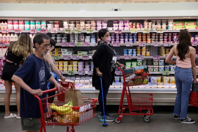 People shop in a supermarket as inflation affected consumer prices in Manhattan, New York City, U.S.
