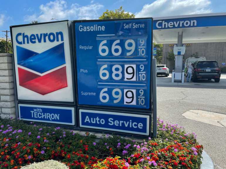 Gas prices are advertised at a Chevron station as rising inflation and oil costs affect the consumers in Los Angeles, California, U.S