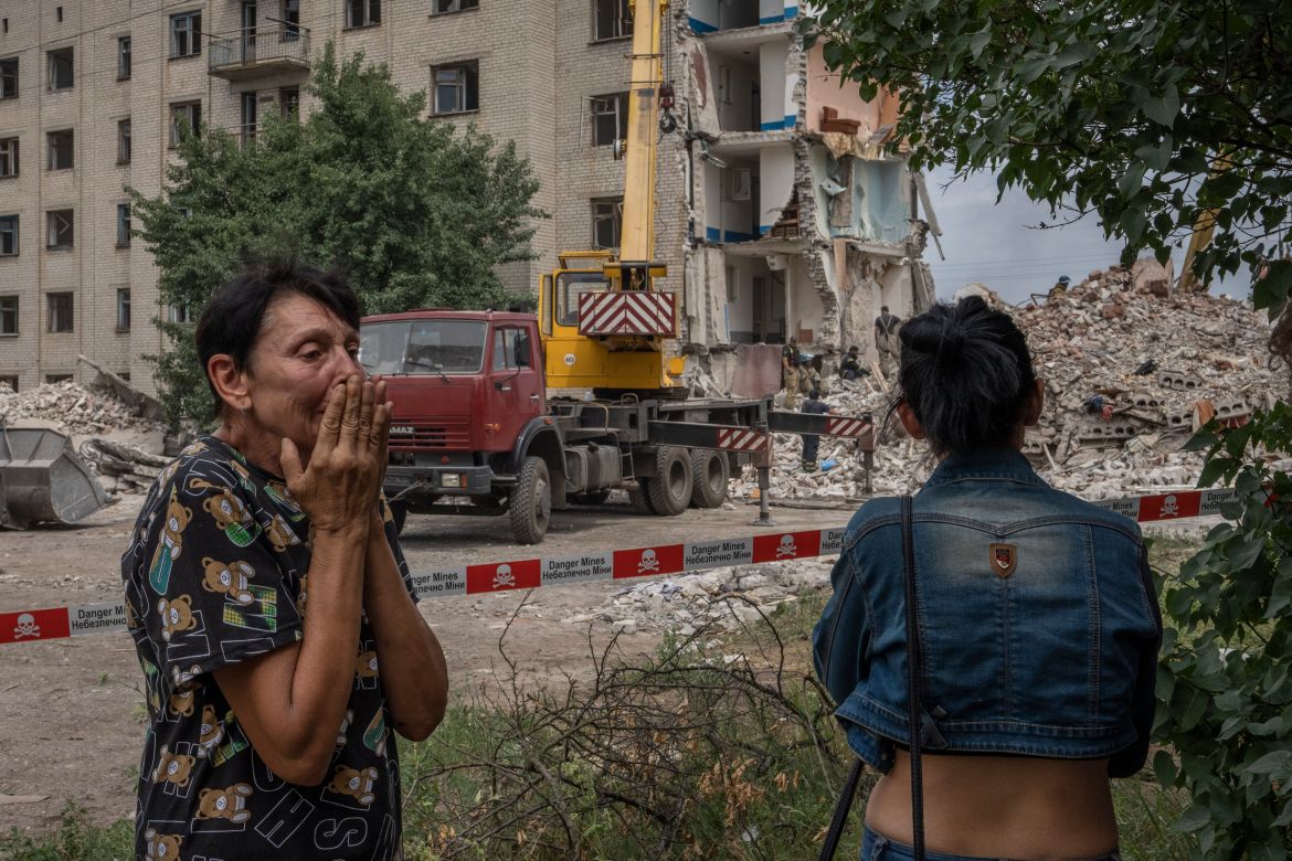 A woman weeps in front of an apartment block reduced to rubble in Chasiv Yar, Donetsk region, eastern Ukraine.