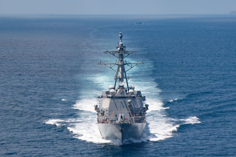 In this handout image courtesy of the US Navy taken on August 27, 2021 the AI Arleigh-burke class guided-missile destroyer USS Kidd (DDG 100) transits the Taiwan Strait during a routine transit