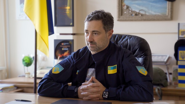 Igor Smelyansky, CEO of Ukrposhta, sits at his desk in Kyiv [Shelby Wilder/Al Jazeera]