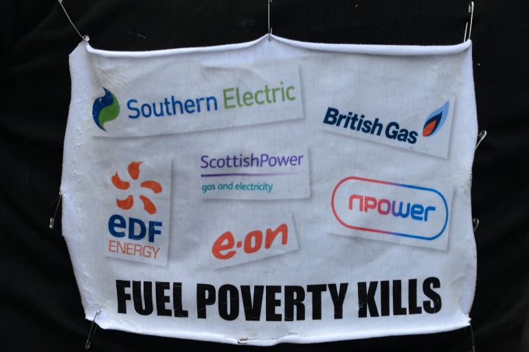 banner a march to the headquarters of energy company during a protest in London