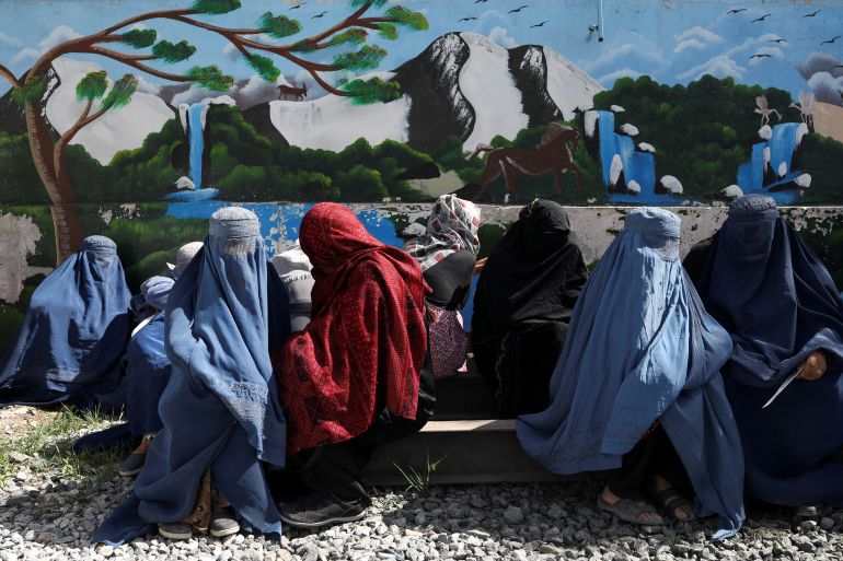 Women in Kabul wait for food packages