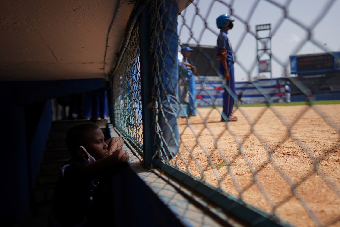 A child watches a baseball match between Industriales and Artemisa at the Latinoamericano Stadium in Havana