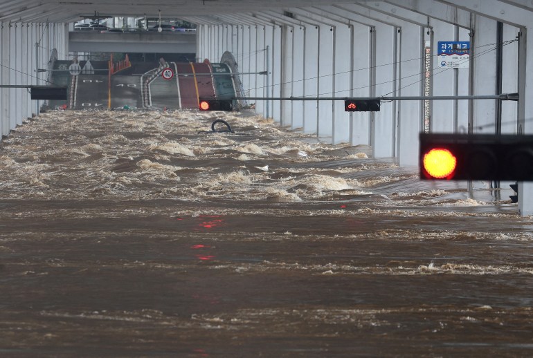 A bridge is submerged by torrential rain of the previous day at Han river in Seoul, South Korea, August 9, 2022