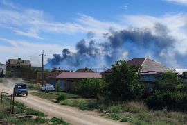 Smoke rises after explosions were heard from the direction of a Russian military airbase near Novofedorivka, Crimea