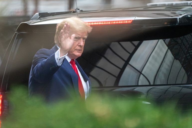 Donald Trump waves as he departs Trump Tower in New York City.