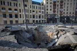 A crater left by a night Russian military strike is seen, as Russia's attack on Ukraine continues, in central Kharkiv.