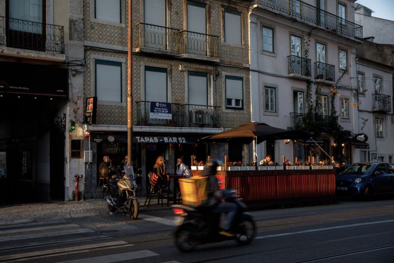 Customers in the outdoor terrace area of a tapas bar in the Principe Real district of Lisbon, Portugal