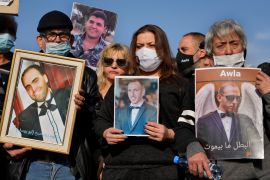 Relatives of victims of the deadly 2020 Beirut port explosion hold portraits of their loved ones and called for no reconstruction before the truth is revealed about the blast, during a protest near the port, in Beirut, Lebanon