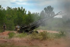 Ukrainian soldiers first from a US-supplied howitzer